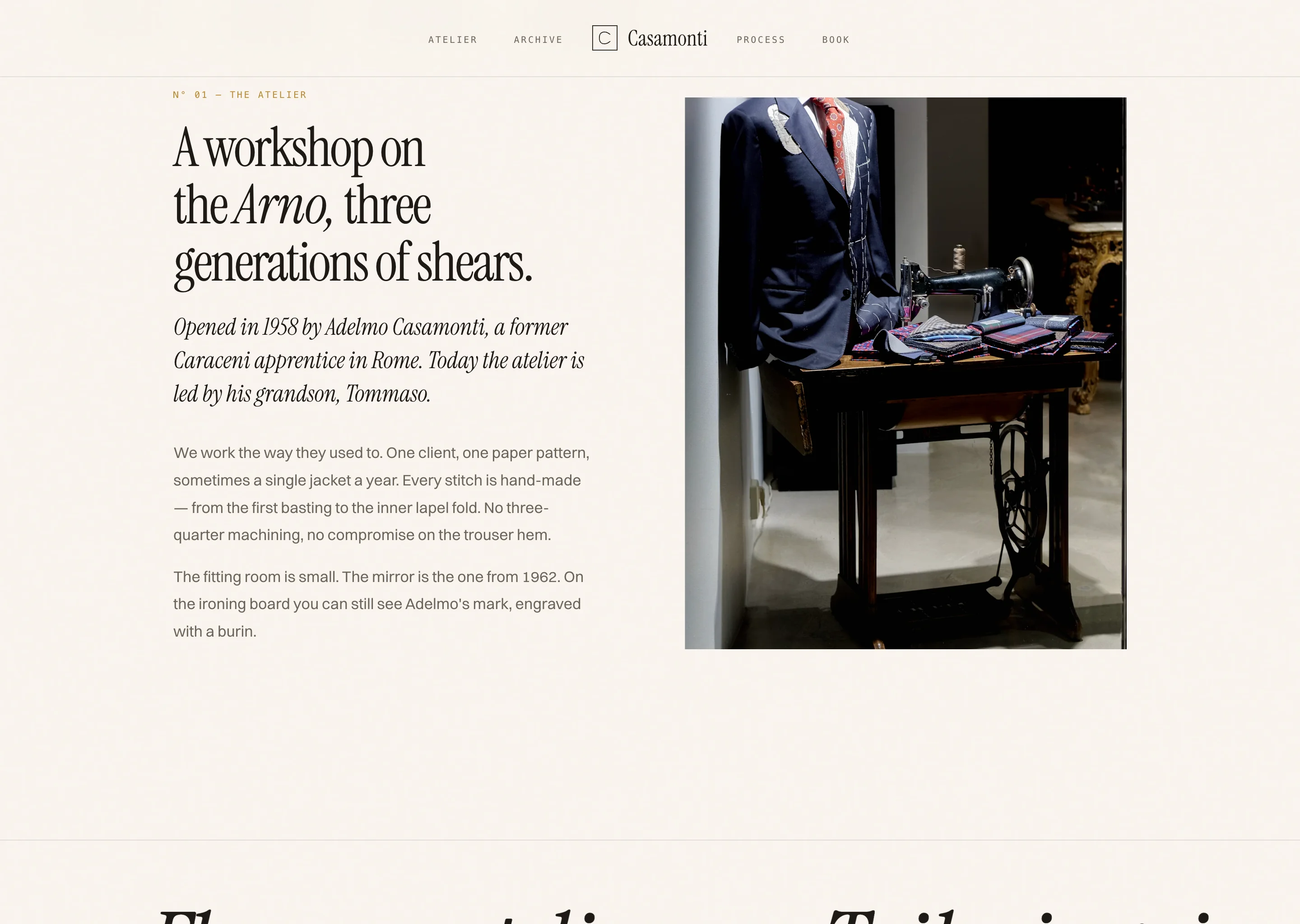 Atelier section of the site. A serif headline "A workshop on the Arno, three generations of shears" beside a photograph of a navy jacket on a form next to a vintage sewing machine.